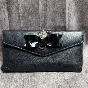 Chic Black Leather Clutch with Bow Detail